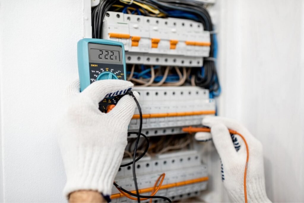 electrician testing elctrical panel in ca home